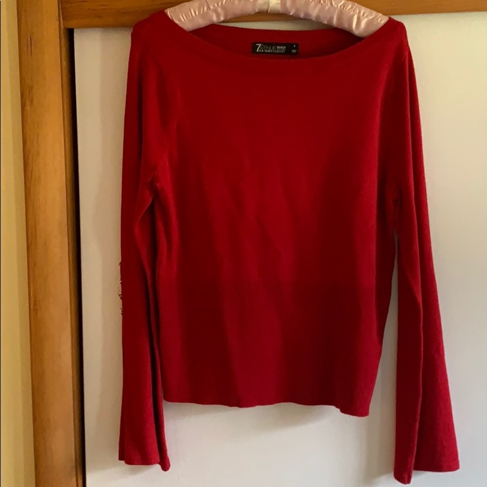 NY&CO Red boatneck sweater with bell sleeves.